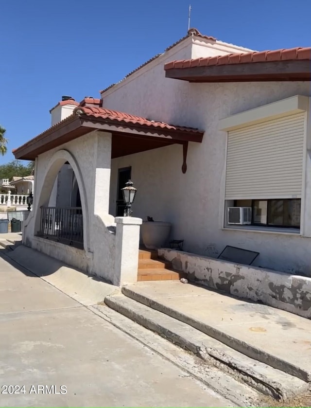 view of property exterior featuring a patio area