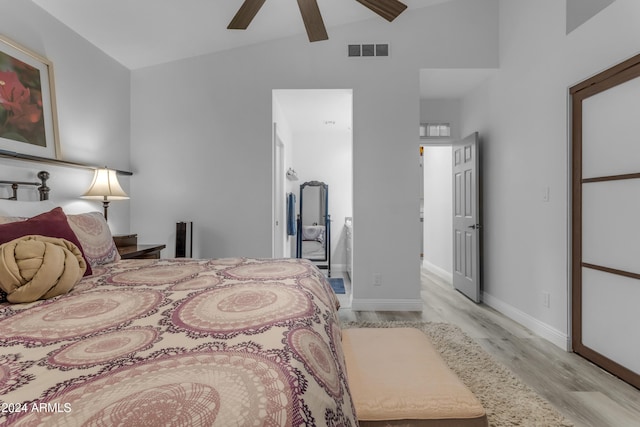 bedroom featuring ceiling fan, high vaulted ceiling, and light hardwood / wood-style floors