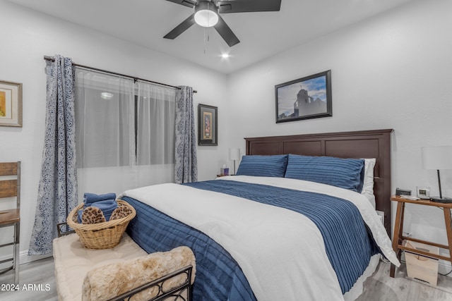 bedroom featuring light hardwood / wood-style flooring and ceiling fan