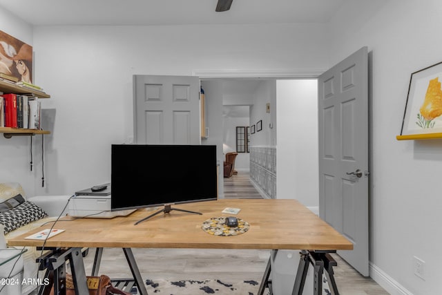 office with light hardwood / wood-style floors