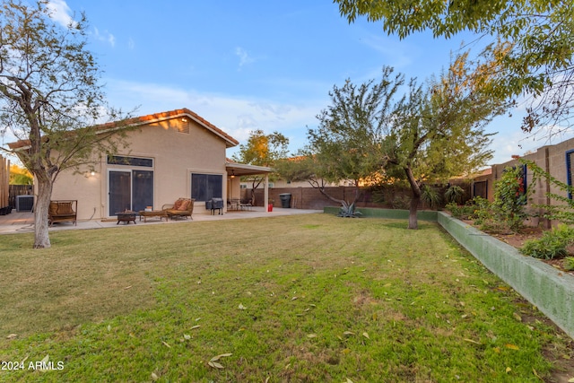 view of yard with an outdoor fire pit and a patio