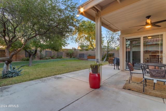 view of patio / terrace featuring ceiling fan