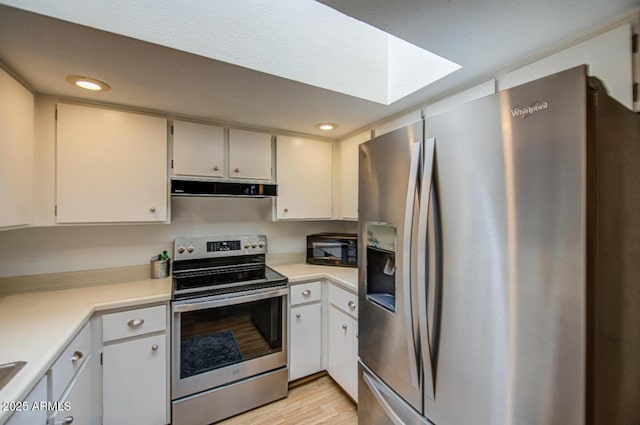 2505 E Desert Cactus St, Phoenix, AZ 85032 - kitchen with appliances with stainless steel finishes, range hood, light countertops, light wood finished floors, and recessed lighting
