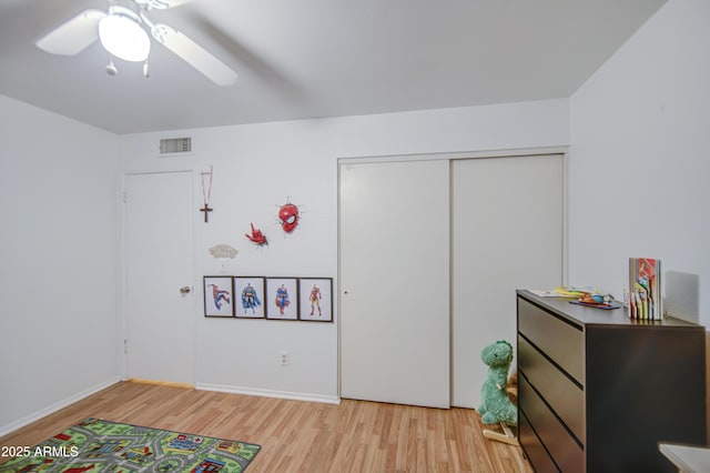 2505 E Desert Cactus St, Phoenix, AZ 85032 - recreation room with light wood-style floors, ceiling fan, and baseboards