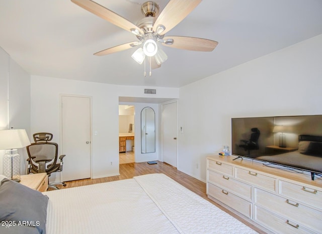 2505 E Desert Cactus St, Phoenix, AZ 85032 - bedroom featuring light wood-style floors, baseboards, and a ceiling fan