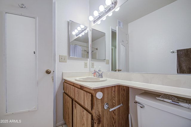 2505 E Desert Cactus St, Phoenix, AZ 85032 - bathroom featuring toilet and vanity