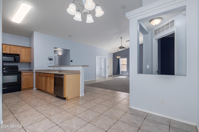 kitchen with black appliances, ceiling fan with notable chandelier, sink, light tile patterned floors, and kitchen peninsula