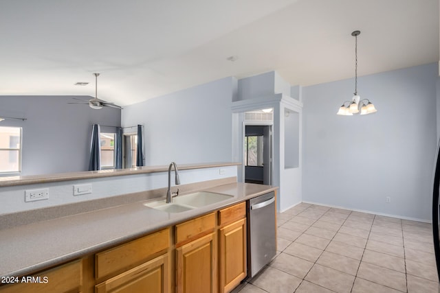 kitchen with a wealth of natural light, dishwasher, vaulted ceiling, and sink