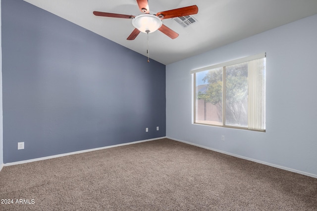 unfurnished room featuring ceiling fan, carpet, and vaulted ceiling