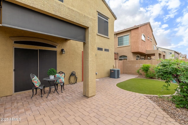 view of patio / terrace with fence and central AC