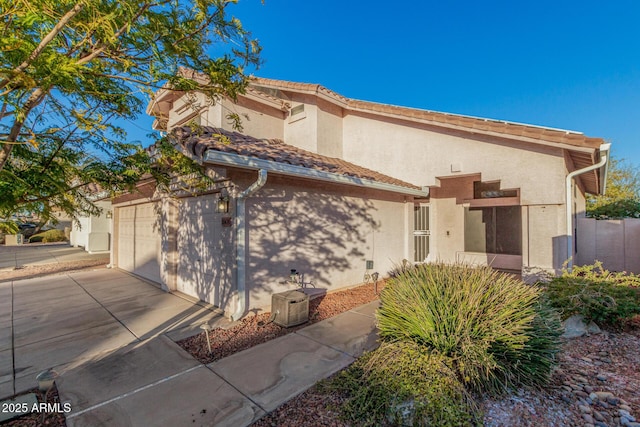 view of front of property with a tile roof and stucco siding