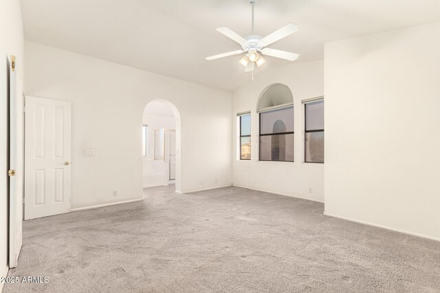 20435 N 39th Dr, Glendale, AZ 85308 - carpeted spare room with a ceiling fan, arched walkways, and lofted ceiling