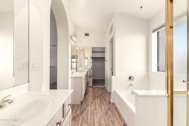20435 N 39th Dr, Glendale, AZ 85308 - bathroom featuring a sink, a bath, two vanities, and visible vents