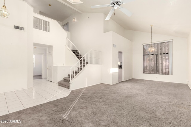 20435 N 39th Dr, Glendale, AZ 85308 - unfurnished living room featuring carpet floors, stairway, tile patterned flooring, ceiling fan with notable chandelier, and visible vents