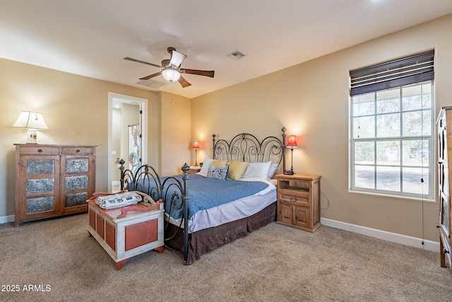 bedroom with ceiling fan and light carpet