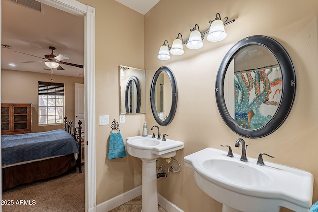 bathroom featuring double sink and ceiling fan