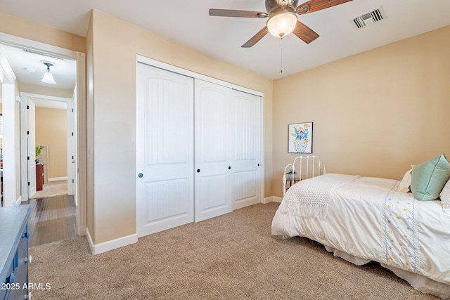 carpeted bedroom featuring a closet