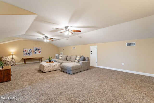 carpeted living room featuring vaulted ceiling and ceiling fan