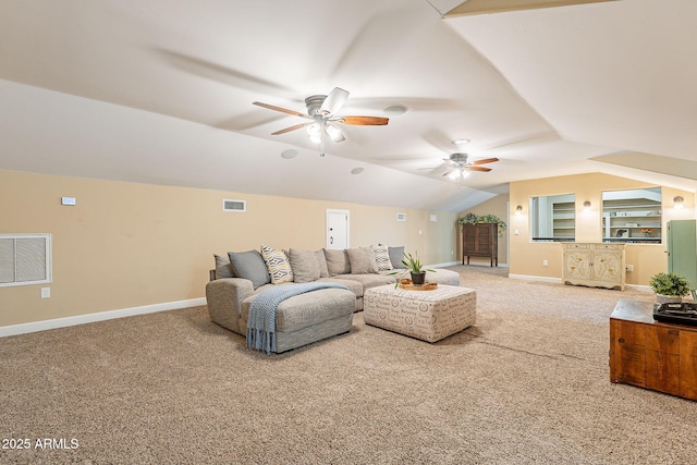 living room with vaulted ceiling, carpet flooring, ceiling fan, and built in shelves