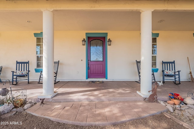 property entrance featuring covered porch