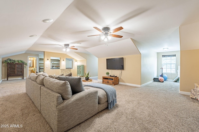 carpeted living room featuring vaulted ceiling and ceiling fan