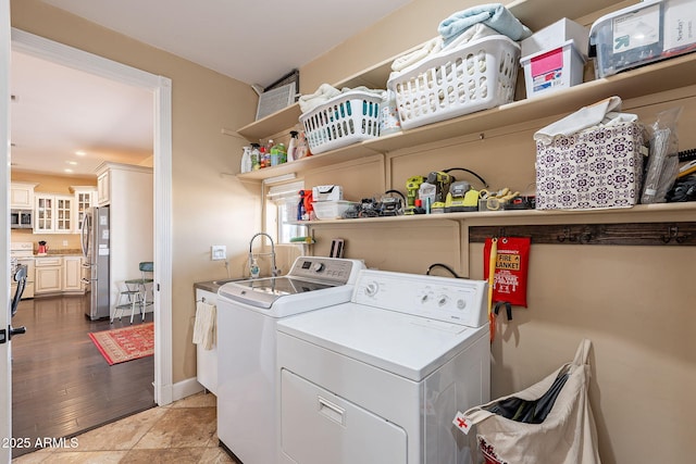 laundry area with sink and washer and clothes dryer