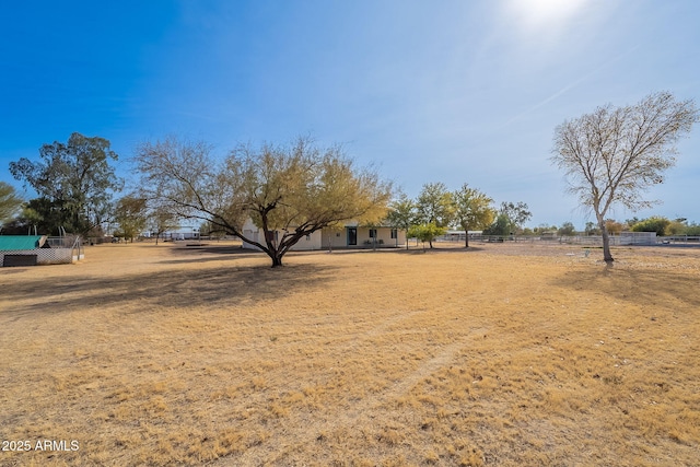 view of yard with a rural view