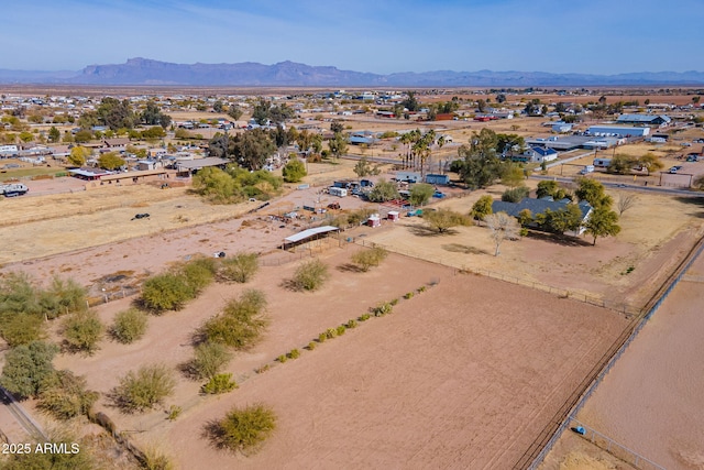 birds eye view of property featuring a mountain view