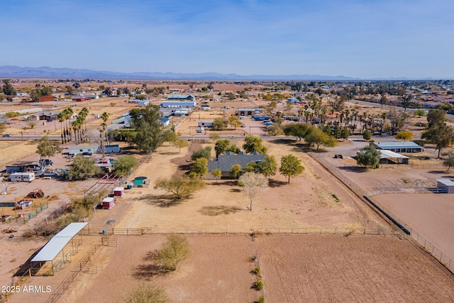 birds eye view of property featuring a mountain view