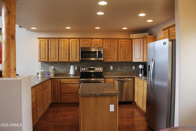 kitchen with tasteful backsplash, recessed lighting, dark wood-type flooring, and stainless steel appliances