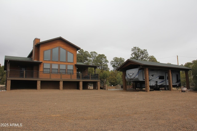 rear view of property with a chimney