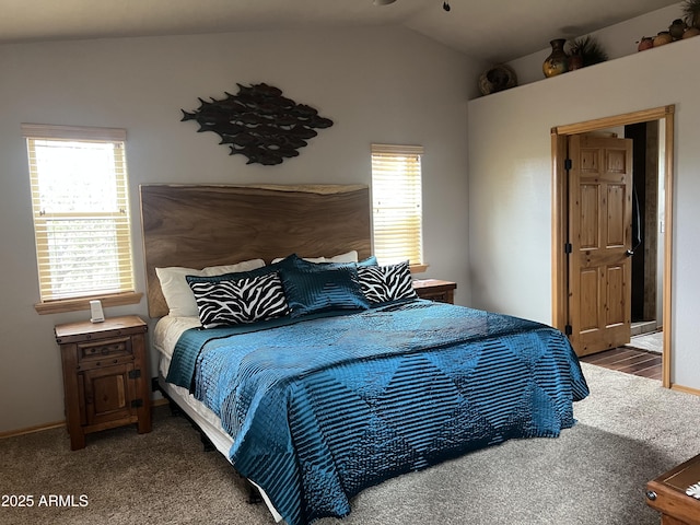 carpeted bedroom featuring vaulted ceiling