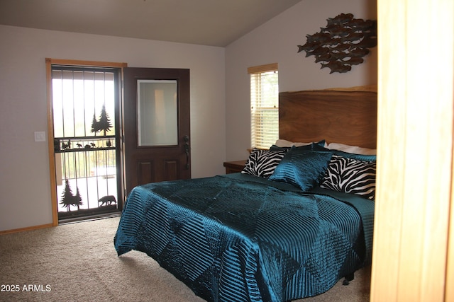 carpeted bedroom featuring baseboards and vaulted ceiling