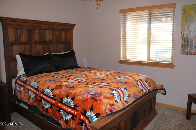 bedroom with baseboards and carpet floors