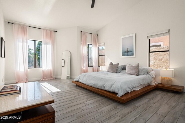 16238 N 58th St, Scottsdale, AZ 85254 - bedroom featuring wood finished floors, lofted ceiling, and a ceiling fan