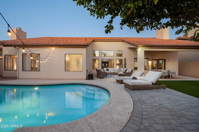 16238 N 58th St, Scottsdale, AZ 85254 - back of house featuring an outdoor living space, a chimney, a patio, and an outdoor pool