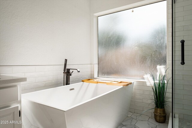 16238 N 58th St, Scottsdale, AZ 85254 - full bath featuring tile walls and a freestanding tub