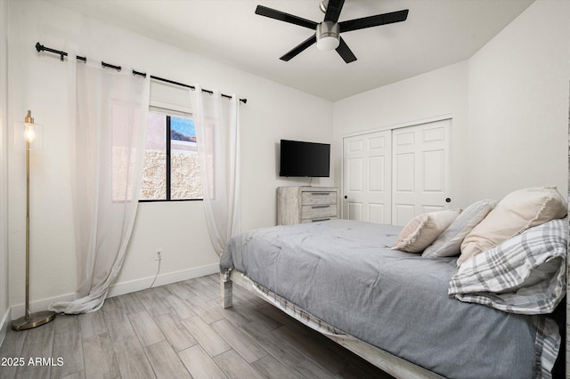 16238 N 58th St, Scottsdale, AZ 85254 - bedroom featuring wood finished floors, a closet, and a ceiling fan