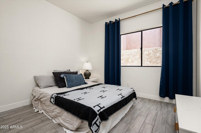 16238 N 58th St, Scottsdale, AZ 85254 - bedroom with light wood finished floors and baseboards