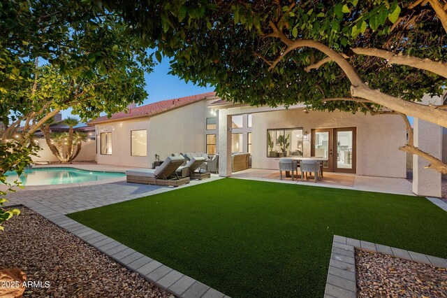 16238 N 58th St, Scottsdale, AZ 85254 - back of house featuring an outdoor pool, stucco siding, and a patio