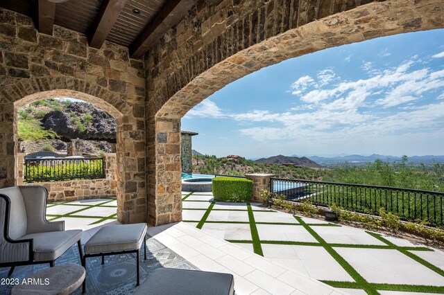 view of patio / terrace featuring a mountain view