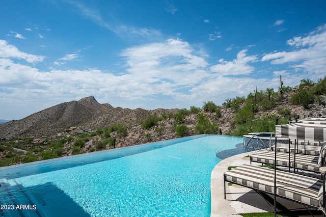 view of pool featuring a mountain view