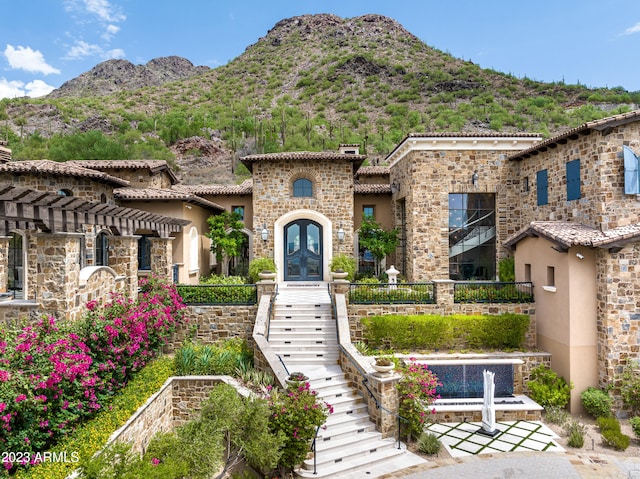 mediterranean / spanish home with a mountain view