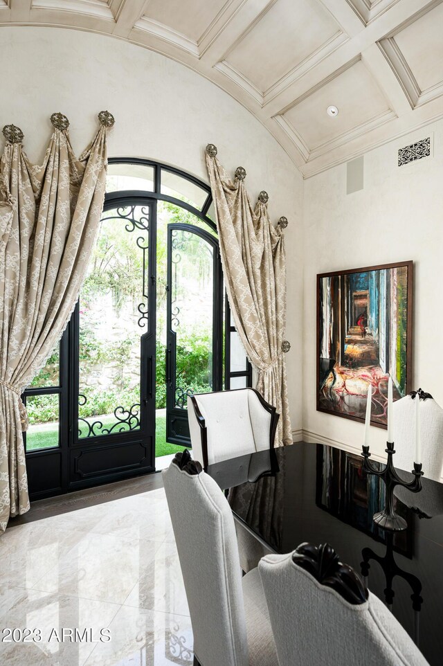 interior space with beam ceiling, coffered ceiling, and crown molding