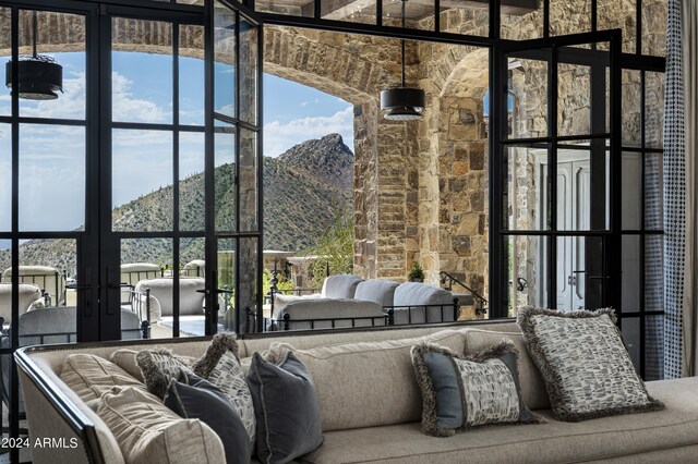 living room with a mountain view and french doors