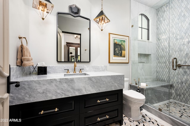 bathroom with tile patterned floors, walk in shower, vanity, and toilet