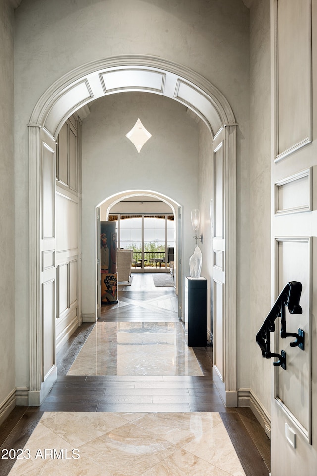 corridor with dark hardwood / wood-style floors