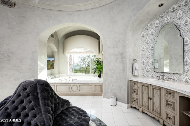 bathroom with vanity, a bathing tub, and tile patterned flooring