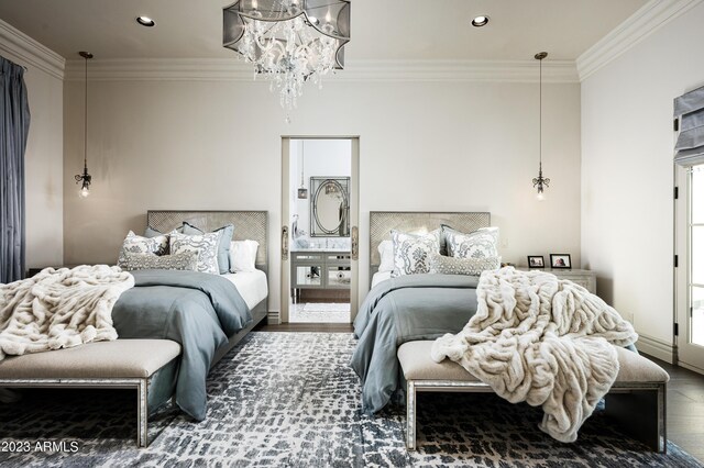 bedroom featuring a chandelier, hardwood / wood-style floors, and crown molding