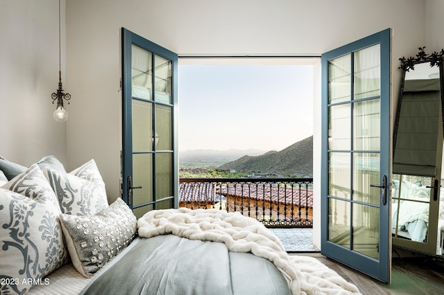 bedroom featuring a mountain view